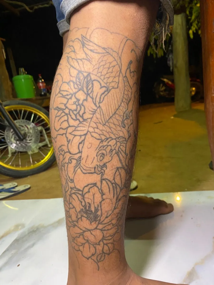 Collection of beautiful carp tattoos on the thighs leading the 2025 trend